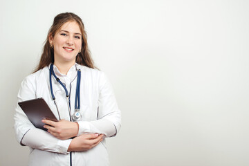 Doctor using tablet computer at work. Healthcare and medicine. Young doctor with stethoscope.