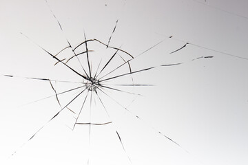 Cracks on the glass on a white background.