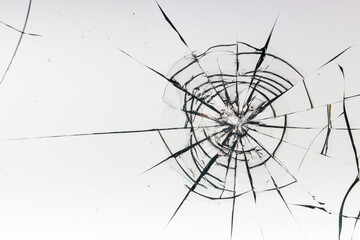 Cracks on the glass on a white background.