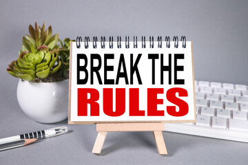 break the rules. text on white paper on gray background