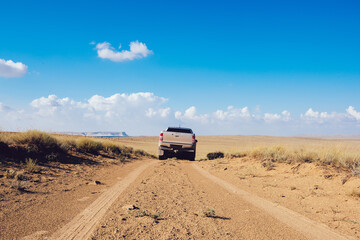 Car driving on empty off road