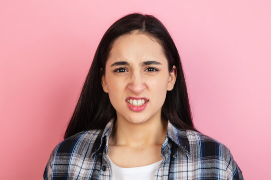 Caucasian Woman's Portrait Isolated On Coral Pink Studio Background With Copyspace