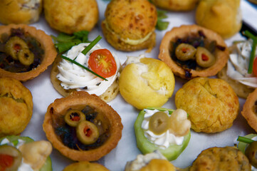 Plate of  assorted Hors D'oeuvres containing olives, cream cheese and chives