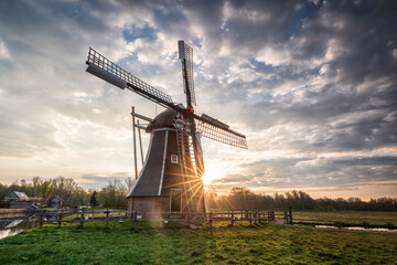 beautiful sunrise behind Dutch windmill
