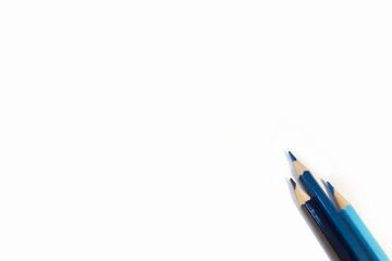 blue coloured pencils on white paper