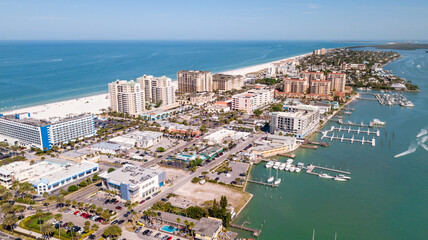 Island Clearwater Beach FL. Ocean or Gulf of Mexico shore. Spring break or Summer vacations in Florida. Hotels, restaurants and Resorts. United States of America. Tropical Nature. Aerial view of city.