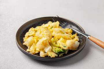 Broccoli and cauliflower baked with egg in a plate on the table. Diet nutrition