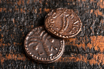 Two Small Copper Coins or Widows Mites on a Rustic Wooden Table