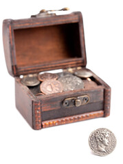 Treasure Chest Filled with Ancient Coins on a White Background