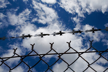 barbed wire against sky
