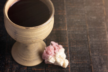 Sacrament of Holy Communion  on a Dark Wooden Table