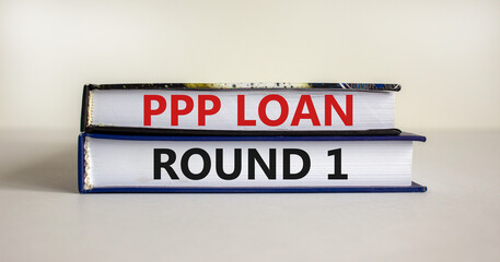 PPP, paycheck protection program loan round 1 symbol. Concept words PPP, paycheck protection program loan round 1 on books on a white background. Business, PPP loan round 1 concept.