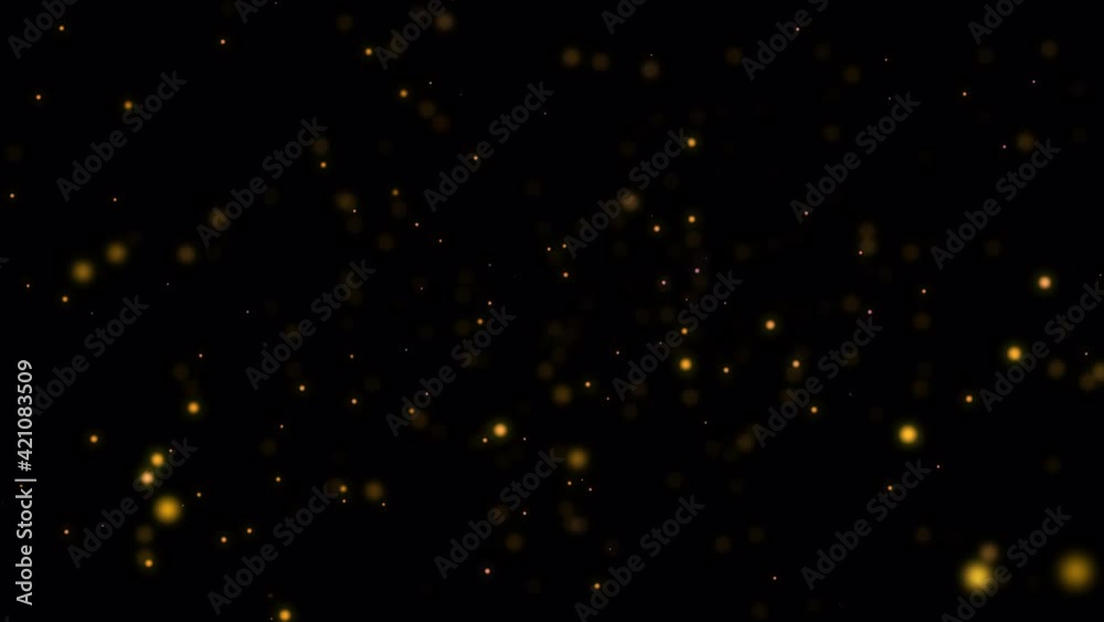Wall mural beautiful golden shimmering dust particles with dark on black background in slow motion. motion grap