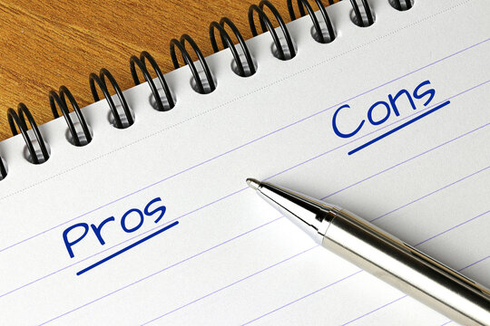 Pros And Cons Headings Written With A Pen On The Page Of A Notebook