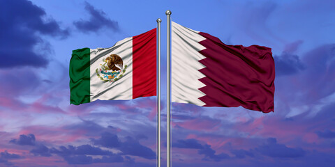 Mexico and Qatar flag waving in the wind against white cloudy blue sky together. Diplomacy concept, international relations.