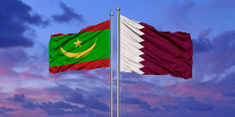 Qatar and Mauritania flag waving in the wind against white cloudy blue sky together. Diplomacy concept, international relations.