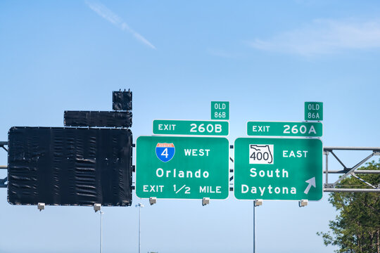 Traffic sign for exits 260A, 260B to 400 East road to South Daytona beach, Florida with direction to Orlando city on interstate highway 4 in summer