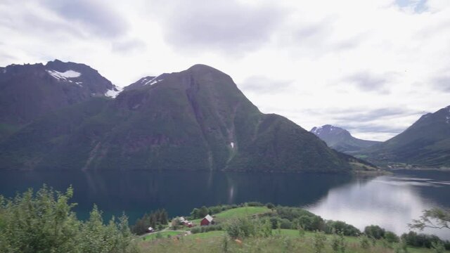 panoramic view of the fjord and the mountains of Sunm&oslash;rsalpene in norway - magnificent scenery