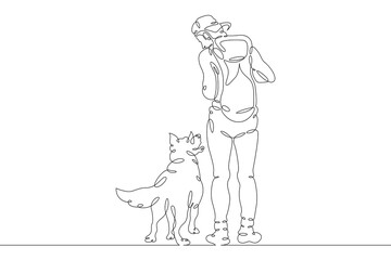 Fototapeta na wymiar A man walking his dog. Owner with his pet. Dog breeding and dog training.