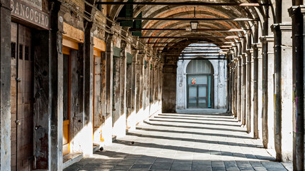Old arched commercial gallery at Venice