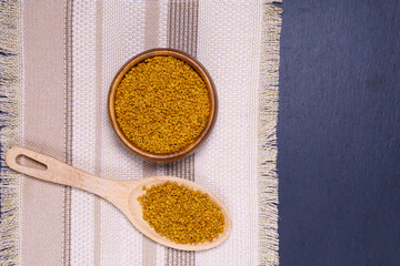 seeds medicinal plant fenugreek on a wooden light table closeup. shambala grains for use in...