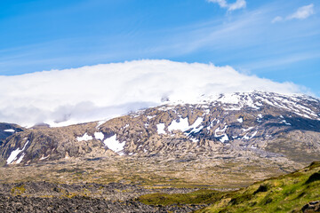 Snaefellsjokull, Iceland snowcapped glacier mountain top peak in national park closeup view of volcanic scenery and blue sky