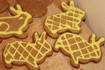cookies yellow Easter gingerbread bunnies on a wooden background
