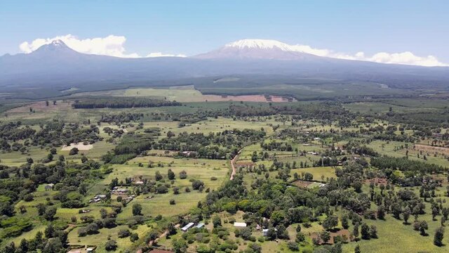 Mount kilimanjaro view . Small settlement of houses with Kilimanjaro background. Kilimanjaro Africa kenya Oloitokitok area.