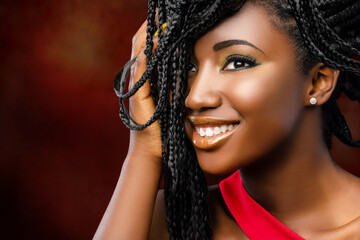 Beauty portrait of young attractive african woman with charming smile.