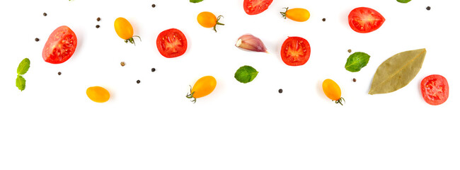 cherry tomato, garlic, pepper and bay leaf. Vegetables isolated on white background. Wide photo. Free space for text.