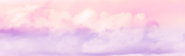 Panorama of twilight sky with effect of light pastel pink colors. Colorful sunset of soft clouds.