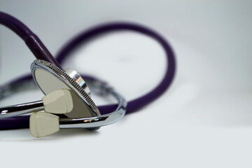 A doctor's stethoscope on a white background. Heart control.