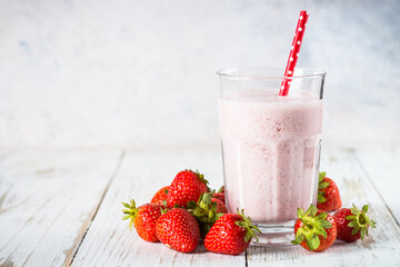 Strawberry smoothie or milkshake at white.