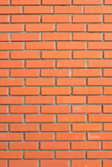 Texture of brick wall. Samples of wall or fence are presented at exhibitions. Orange brick close up.
