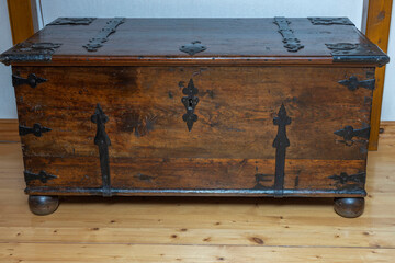 Close up view of an closed antique chest isolated on background. The concept of industrial old equipment. Sweden.