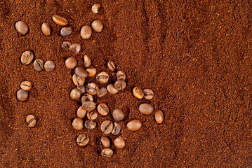 Coffee beans close up. Texture of ground and grain coffee.