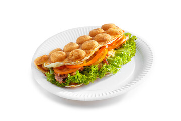 Bubble waffle with fried bacon, eggs, tomato and salad