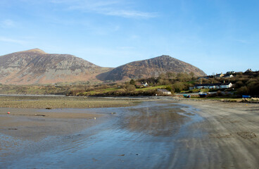 Trefor beach, Wales. Secluded bay near Snowdonia on the Llyn Peninsula on a sunny, bright spring day. Peaceful serene countryside. Landscape aspect. Clear blue sky provides copy space.