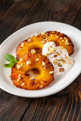 Roasted pineapple with pistachios