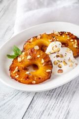 Roasted pineapple with pistachios