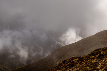 Fog in the green mountains, Azores travel destination.