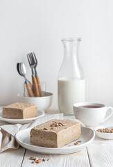 Still life with halva on a light background. Vertical view.