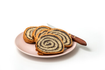 Homemade poppy seeds pie isolated on white background, dessert and decoration for Christmas, rolled up traditional poppy pie