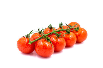 Fresh cherry tomatoes on a branch with water drops. White background.