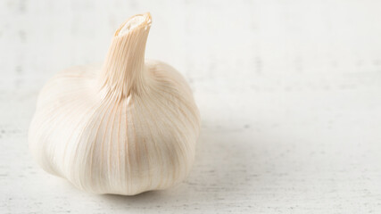 Garlic Bulb on a White Wooden Table
