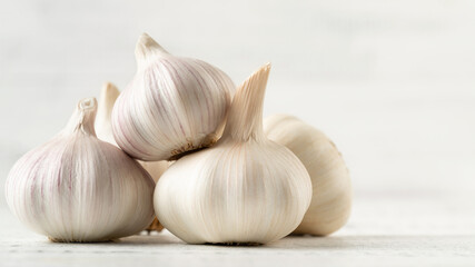 Several Garlic Bulbs on a White Background