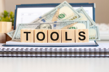 word tools writing on wodeen cubes, business concept