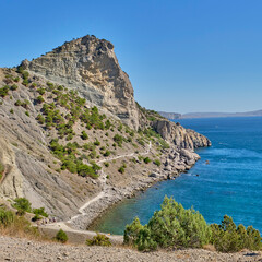 Fototapeta na wymiar Cape Chiken, Blue Bay of the Black Sea near the village of Novy Svet, Crimean peninsula. Golitsin trail tourist route.