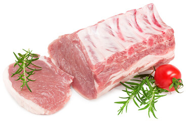 raw pork meat with rosemar, tomato and peppercorn isolated on white background. Clipping path and full depth of field