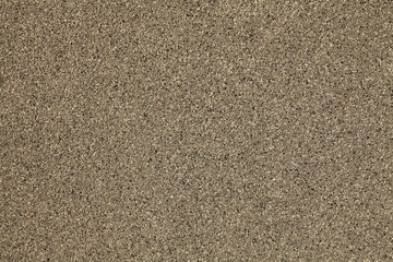 Mosaic and granulated textured coating, texture, background. Structural plaster, rough, uneven surface in brown color. Modern exterior cladding of multi-story buildings